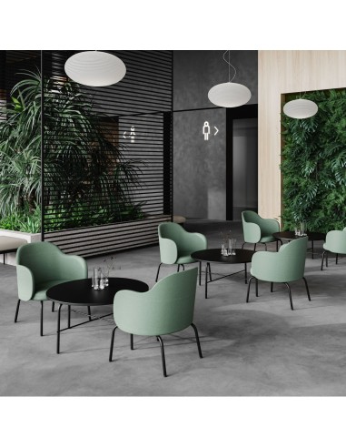 Fauteuil Flos Lounge en tissu vert sur une terrasse extérieure moderne – Flos Lounge