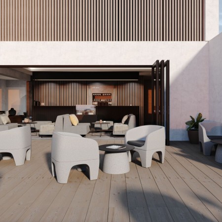 Fauteuils Gummy Bear autour d’une table basse dans un espace de détente – Gummy Bear