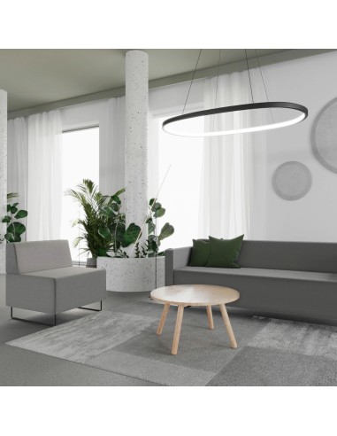 Espace d’attente design avec canapé modulaire gris foncé et table claire. - Quadra