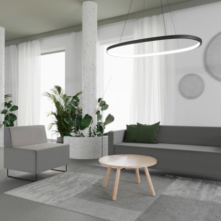 Espace d’attente design avec canapé modulaire gris foncé et table claire. - Quadra