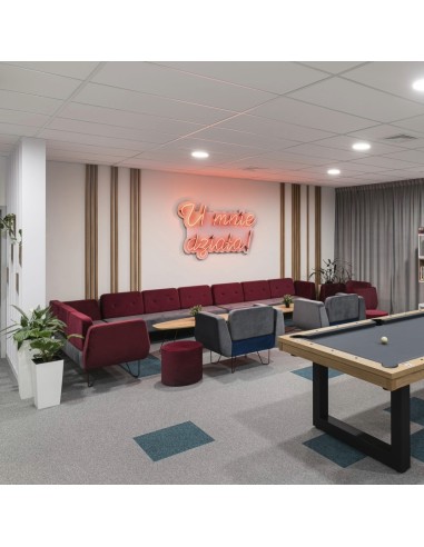 Zone lounge accueillante avec mobilier coloré et ambiance détendue. - U Floe