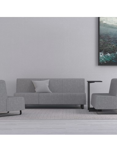 Salon minimaliste avec canapé gris modulable et mur clair. - Voo Voo