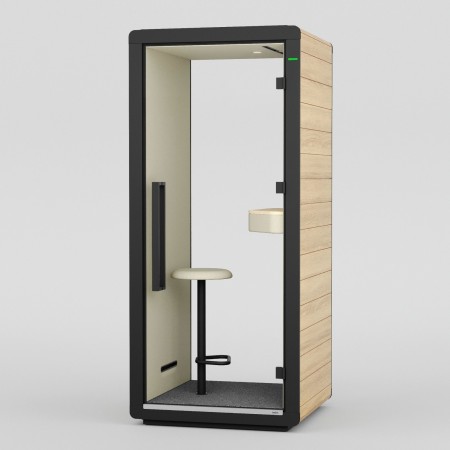 Cabine Flathouse pour une personne, équipée d’un siège et d’une tablette. - Flathouse