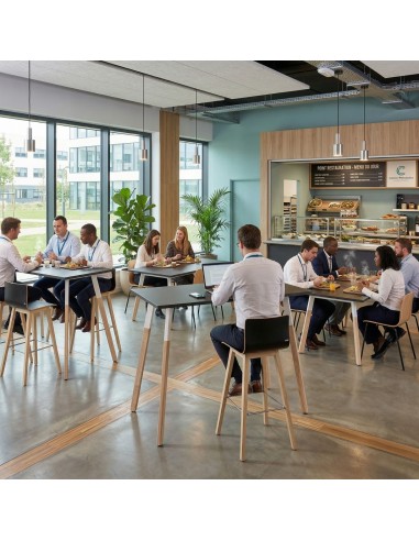 Table haute cafétéria entreprise Orte bois et métal dans espace pause de bureaux modernes à Genève.