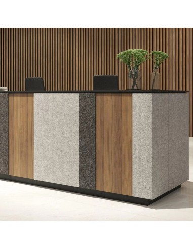 Mobilier d’accueil DOMINO en U dans une zone de réception à Fribourg.