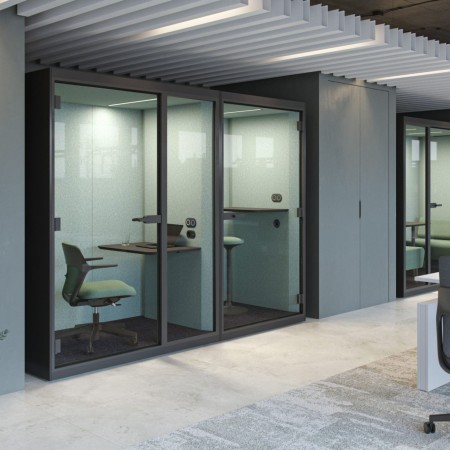 Cabines acoustiques SONUS S+ installées dans un open space moderne à Sierre.