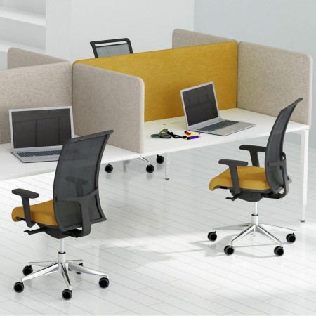 Chaise ergonomique DIVA installée dans un espace de travail collaboratif moderne à Lausanne.