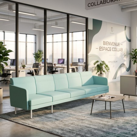 Coin détente dans une salle de coworking à Fribourg avec canapé bleu modulaire ARCIPELAGO pieds métal blanc.