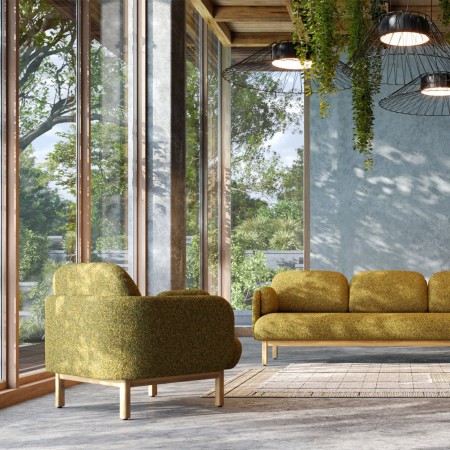 Fauteuils et canapé lounge MYAMI avec structure en frêne massif dans un espace d'accueil professionnel lumineux à Sierre.