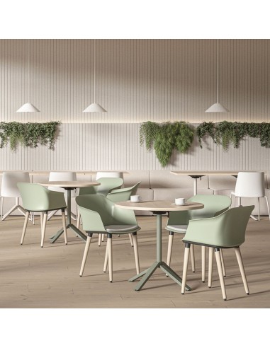 Tables bistro rondes FLIPTOP dans une cafétéria d’entreprise aménagée à Lausanne.