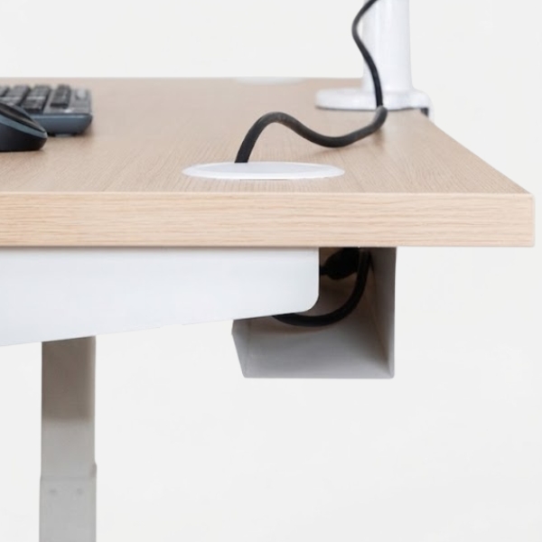 Gestion des câbles sous le plateau du bureau assis-debout Move-Up pour un poste de travail organisé